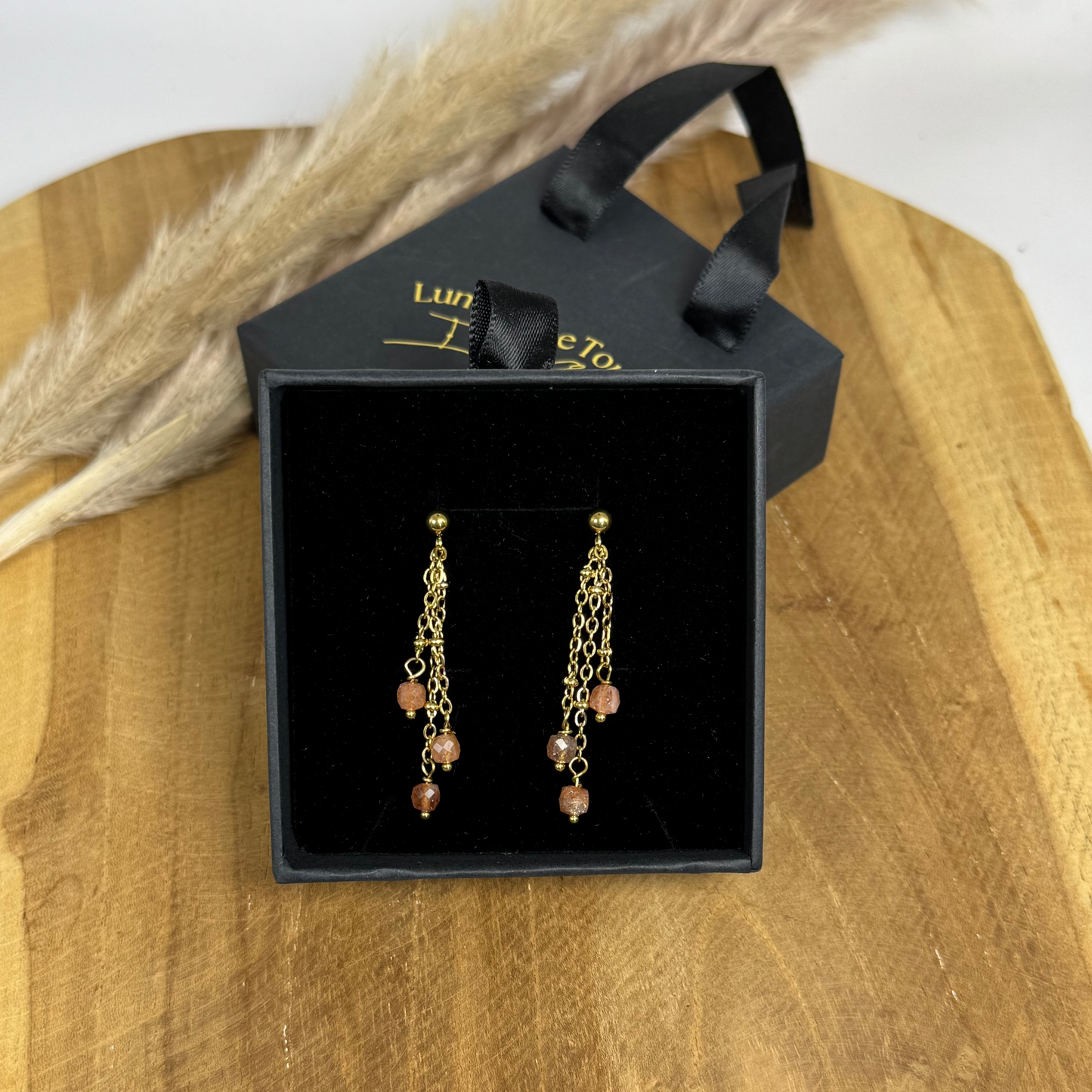 Boucles lumipluie de pierre de soleil
